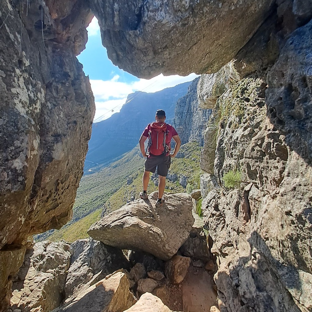 A man standing in the India Venster rock formation. 