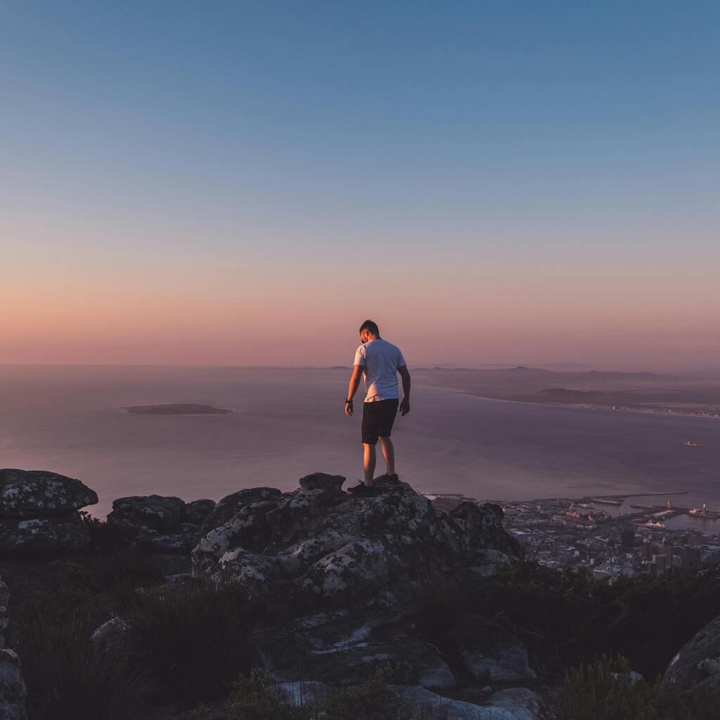 A lone hiker at sunset.