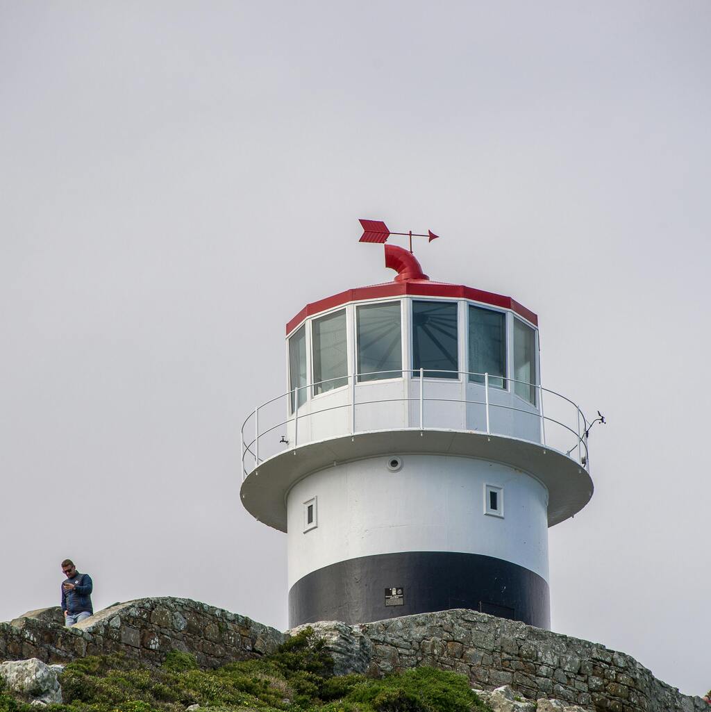 A lighthouse overlooking the rocky coast.